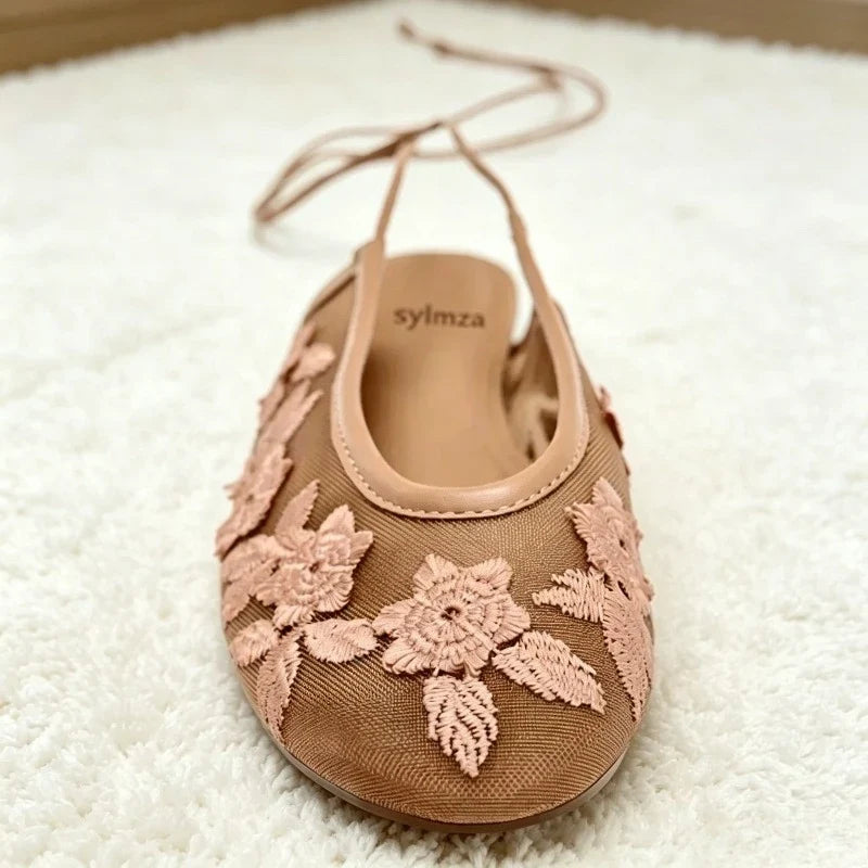 Women’s mesh ballet flats with embroidered floral design and breathable hollow detailing